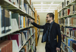 Jesse browses in the library